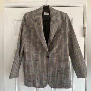 Women’s XS, lightly worn, slightly over sized. Blue beige plaid.